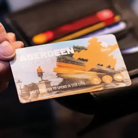Person holding Aberdeen Gift Card